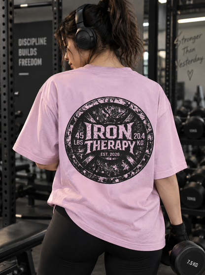 Female wearing Iron Therapy pump cover with large back print in gym