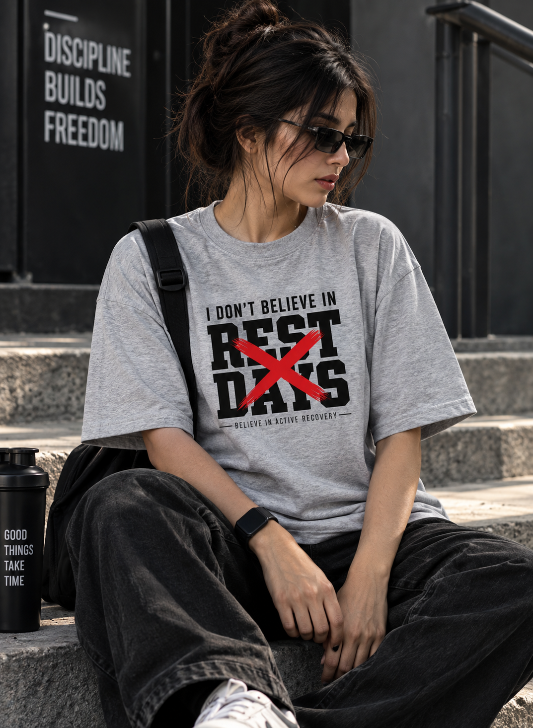 Female model wearing grey Rest Days oversized gym t shirt by UNIMCOLL