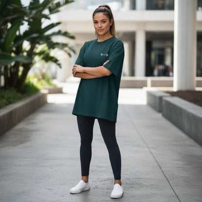 Woman wearing dark green Mind Set oversized gym T-shirt with dumbbell front graphic
