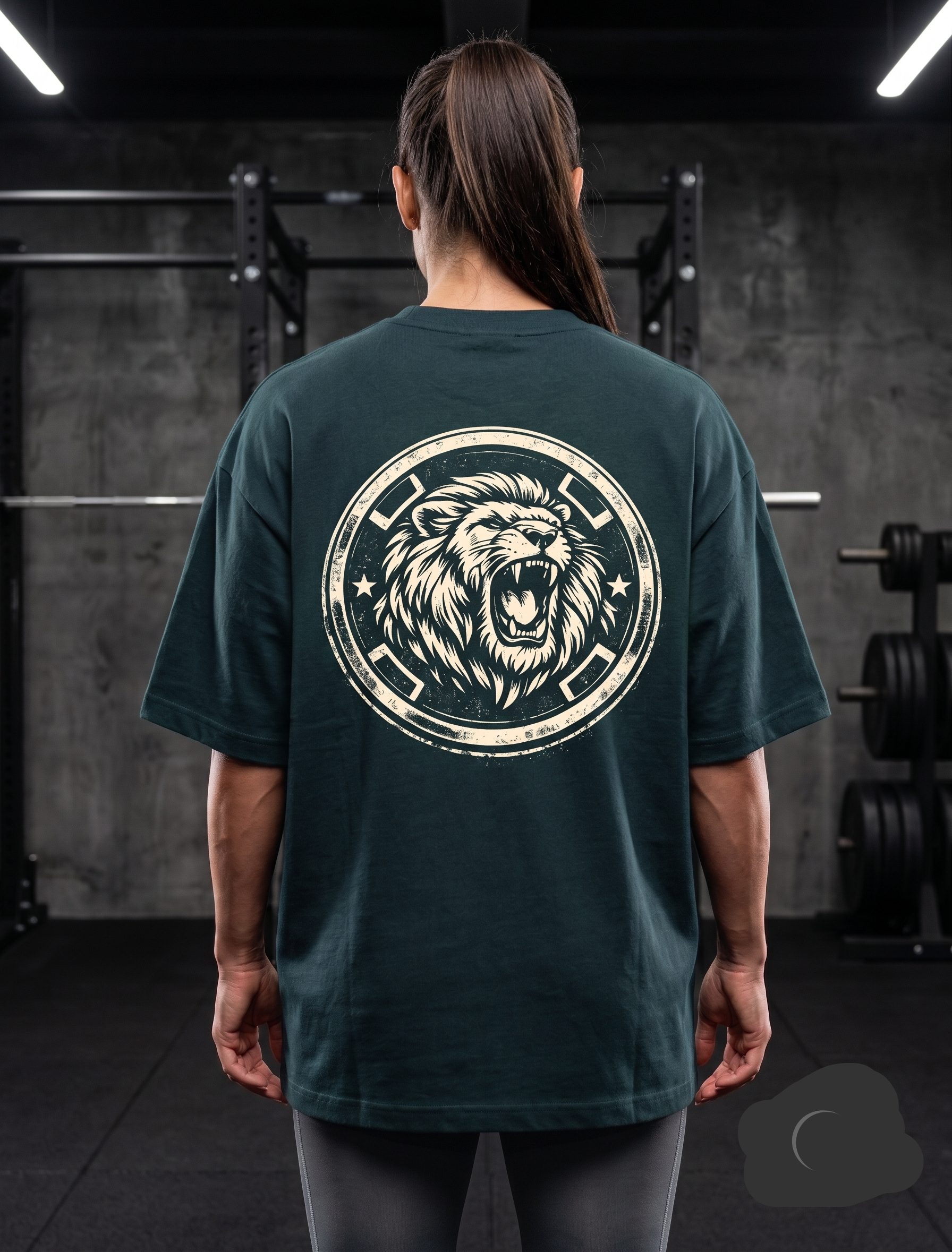 Woman wearing dark green lion graphic oversized gym t-shirt in gym
