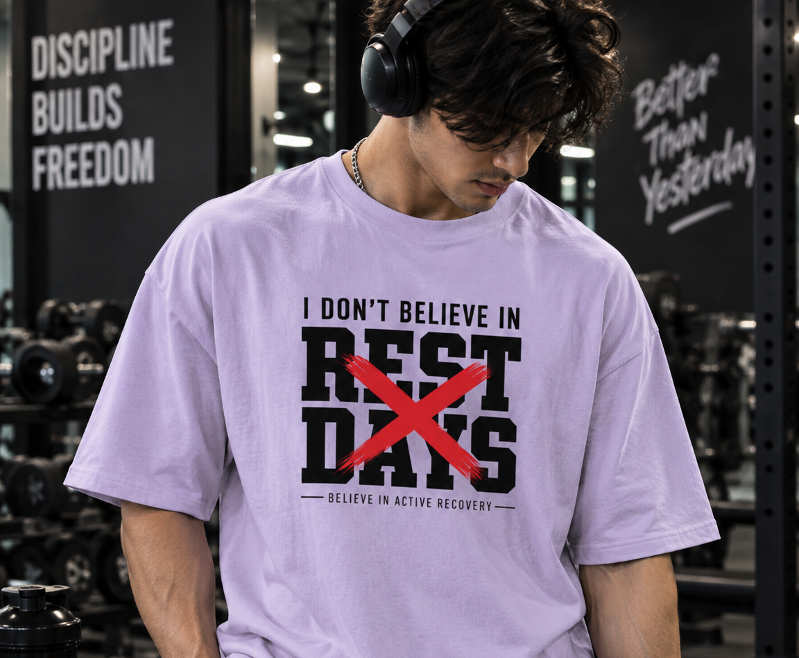 Male model wearing UNIMCOLL white oversized Rest Days gym t shirt