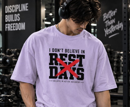 Male model wearing UNIMCOLL white oversized Rest Days gym t shirt