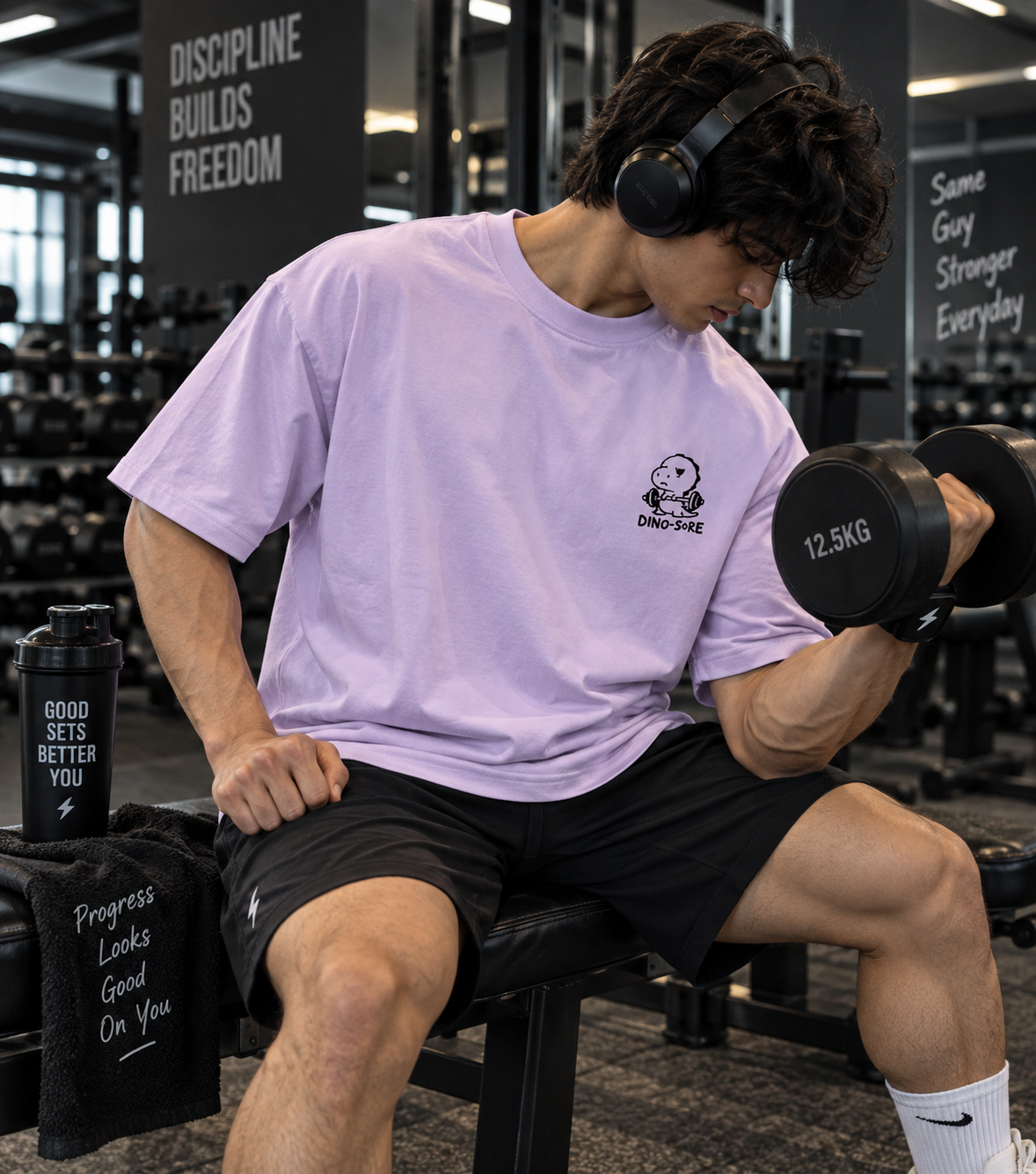 Male model wearing lavender Dino-Sore oversized gym T-shirt front view