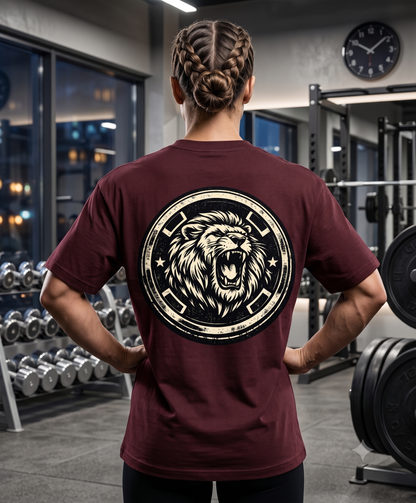 Woman wearing dark green oversized gym t-shirt with large lion back graphic