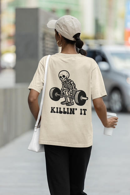 Killin' It skeleton gym oversized t-shirt front view in cream color