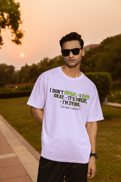 "Lavendar unisex oversized standard t-shirt featuring a funny text graphic about gym sweat and 'the pump' hanging in a studio setting."