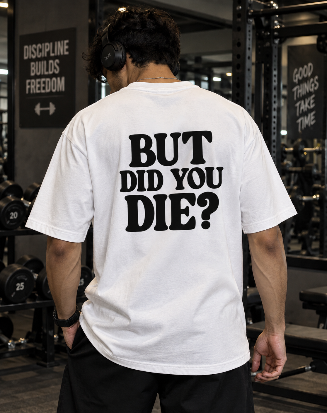 Male model wearing white But Did You Die oversized gym t-shirt